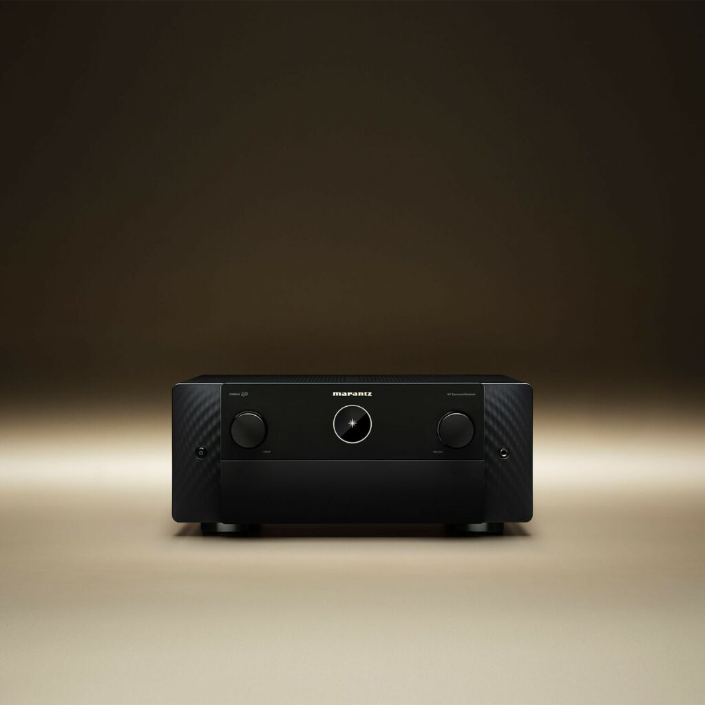 How to Set Up AV Receiver Room Correction for Better Home Cinema Sound 10 The simple and stylish aluminum front is dominated by the golden Marantz logo and the iconic round display, while secondary buttons and the main display are hidden behind an aluminum hatch.